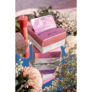 Pink and purple product packaging with floral decorations