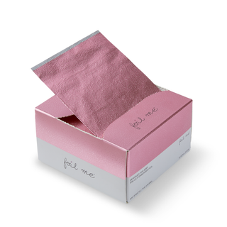 A box of Foil Me brand pink-colored hair foil sheets with the product name 'FOIL ME The Knobel Original 500 Sheets' visible on the packaging.