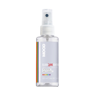 A clear spray bottle labeled 'MOOD Elixir Love Edition' with a rainbow-coloured stripe design, indicating a connection to LGBTQ+ community.
