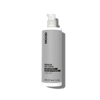 A bottle of MOOD Keratin 2In1 Cream for long hair, with a grey label and a pump dispenser.