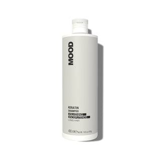A bottle of MOOD Keratin Shampoo with a white label and cap, on a white background.