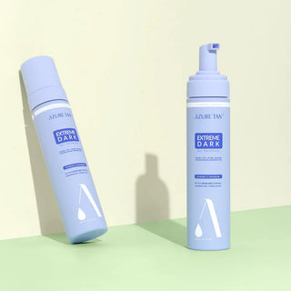 Two bottles of Azure Tan Extreme Dark tanning product on a light green background