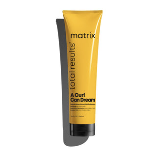 A yellow tube of MATRIX A Curl Can Dream Mask designed for curls and coils with Manuka honey extract.