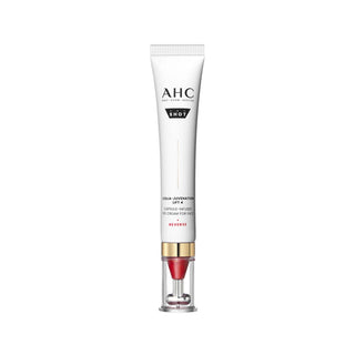 A single cosmetic tube centered on a plain white background. The tube is white with black text reading AHC and SHOT, plus smaller text for Cellular Reviver SPF 40, and a clear cap showing a red and gold internal applicator.