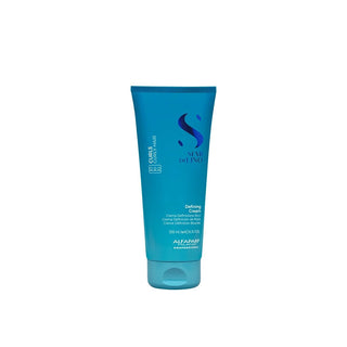 A tube of Alphaparf Semi Di Lino Defining Cream in a vibrant teal-blue color, shown against a plain white background.