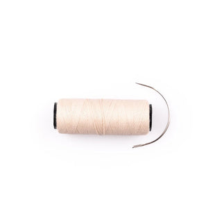 Spool of thread on a white background