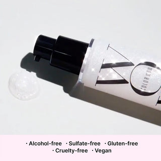 Cosmetic tube with visible brand logo on a light background, featuring text about product attributes.