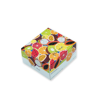 Colorful cube-shaped box with fruit design on a white background