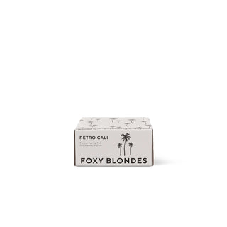 Foxy Blondes product packaging with palm tree design on a white background