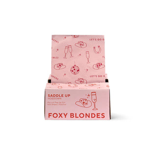 Pink packaging box with 'Foxy Blondes' branding on a white background