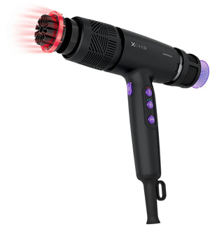 Black hair dryer with attachments on a white background