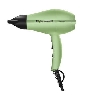 Green hair dryer with black nozzle on a white background