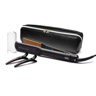 Black hair straightener with attachments and carrying case on a white background