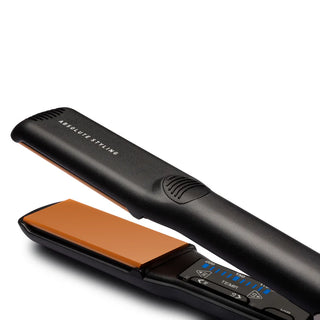 Black hair straightener with brown heating plate on a white background