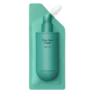 Teal bottle of Cica Care Cream with a pump on a green background