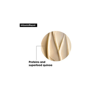 Close-up of a cosmetic product with 'AbsolutRepair' text and 'Proteins and superfood quinoa' label on a white background.