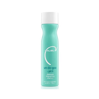 A mint green bottle of Malibu Un-Do-Goo pH 9 shampoo with a white cap, centered on a white background.