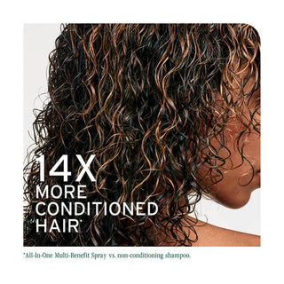 Close-up of curly hair with text about conditioned hair and a brand name.