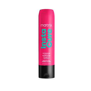 Pink bottle of Matrix Insta Cure conditioner on a white background