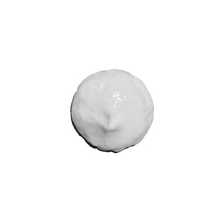 White cream or paste on a white background