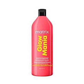 Red bottle of Matrix Glow Mania product on a white background