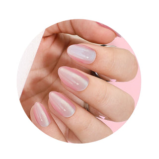 Close-up of a hand with pink and white gradient nail polish on a white background