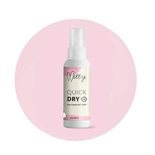 Nitty Quick Dry nail polish dryer spray bottle on a pink background