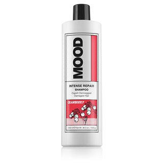 A bottle of MOOD Intense Repair Shampoo with a white and red label, designed for dry and damaged hair.