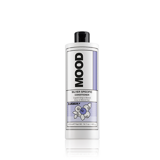 A bottle of MOOD Silver Specific Conditioner with blueberry imagery, designed for grey or blond hair.