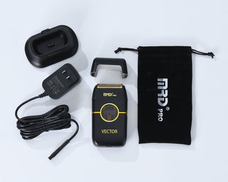MRD Pro Vector shaver with charging cable, adapter, and carrying pouch on a white background