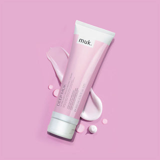 Pink 'muk.' Hair care product on a pink background