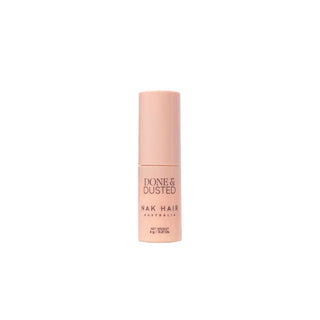 Pink hair product bottle labeled 'Done & Dusted' on a white background