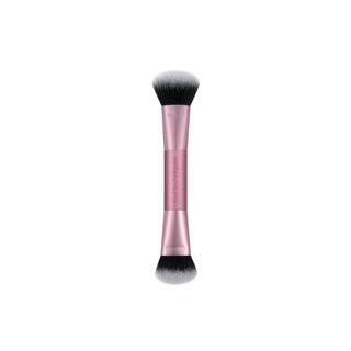 A dual-ended makeup brush with a metallic rose gold handle and black and white bristles, shown vertically on a plain white background.