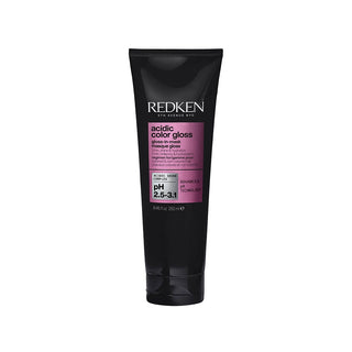 A black squeeze tube of Redken Acidic Color Gloss on a plain white background.