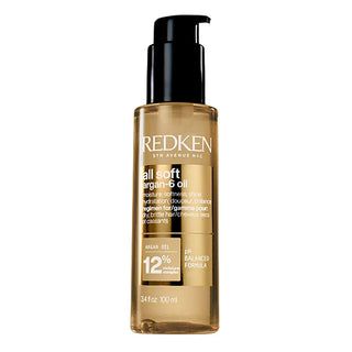 Redken hair oil bottle on a white background
