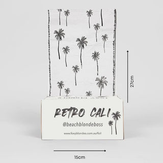 A box of Foxy Blondes Retro Cali Pre-cut Pop Up foils with black palm trees on a white background, measuring 27cm x 15cm.