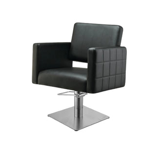 Black leather salon chair with a metal base on a white background
