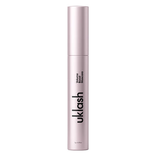 Pink mascara tube with 'uklash' branding on a white background