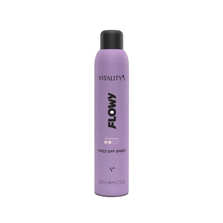 A lavender purple aerosol can of Vitality's Flowy Frizz Off Spray with a black cap, centered on a plain white background.