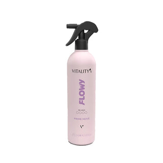 A 250ml spray bottle of Vitality's Flowy Prime Move hair product, featuring a light pink bottle body, black trigger sprayer, and purple text on a white background.