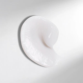 White ceramic dish shaped like a heart on a light gray background
