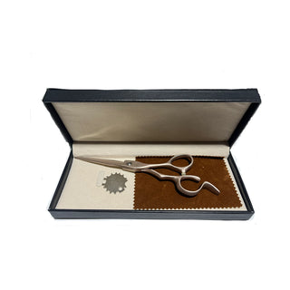 Pair of scissors in a black box with a white background